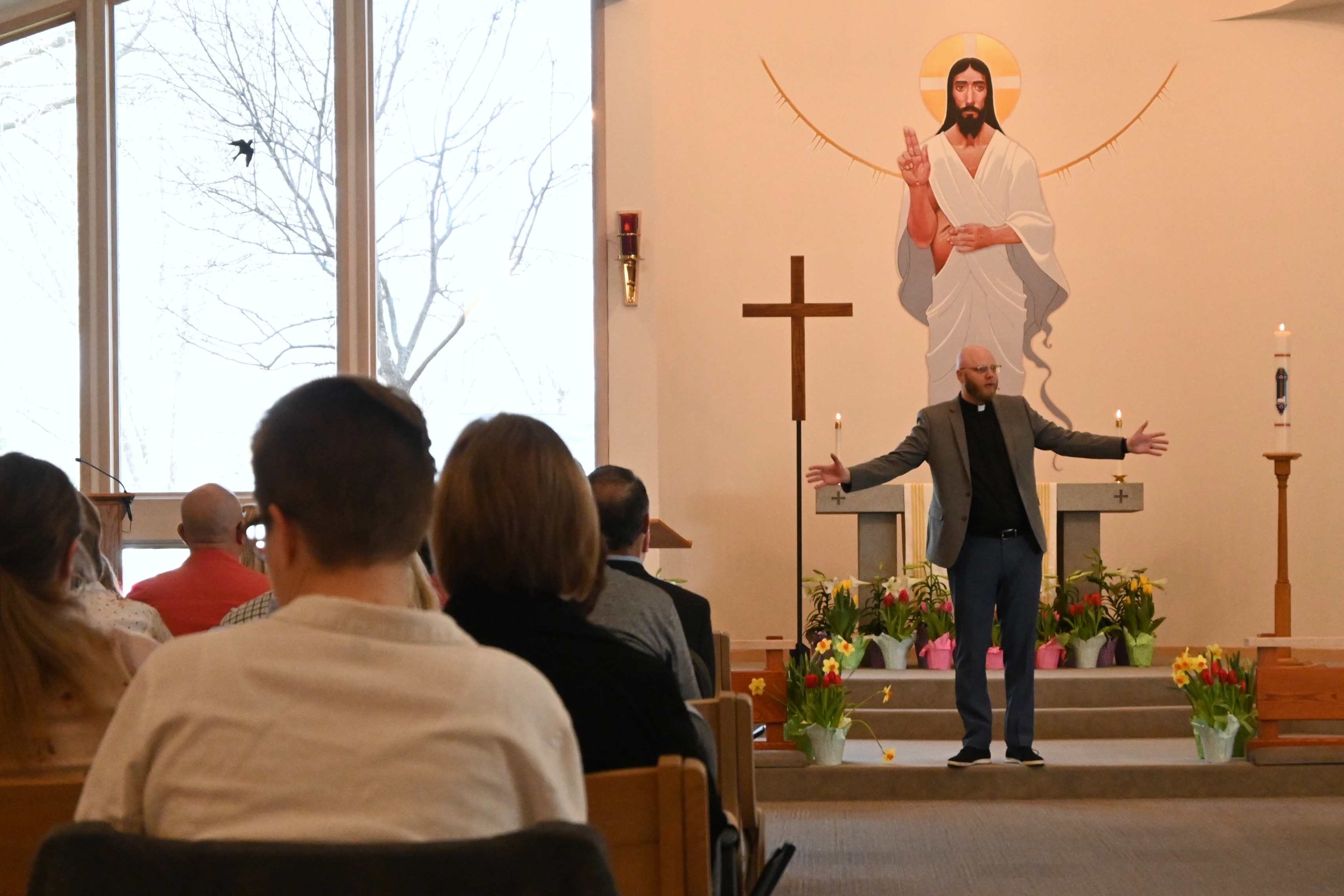 Pastor Adam giving sermon to congregation